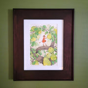 Ink and watercolor drawing of a small girl in a red dress, standing in a tree with thick branches and fruiting pears. She holds a long wand and looks off to the side. Piece is matted into a thick wooden frame.