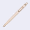 Beige pen on a light gray background