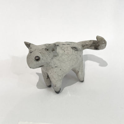 Ceramic sculpture of a gray mouse.
