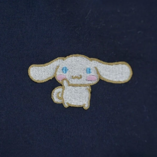 Navy blue hoodie with a small embroidered image of Cinnamoroll on the upper chest. 
