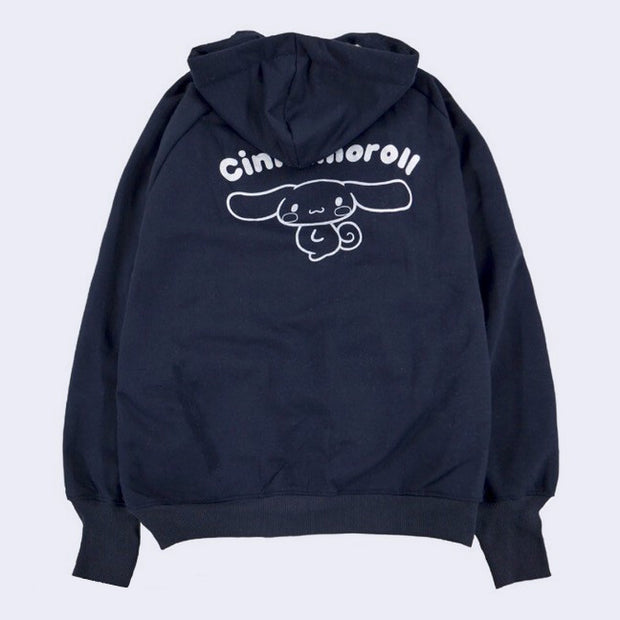 Navy blue hoodie with a white line art illustration of Cinnamoroll accompanied by his name atop.