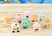 Blind boxed figures of assorted small, cute animals eating food or sipping drinks. Options are pigs, cats, dogs, cow, dragon, bunny or hamster.