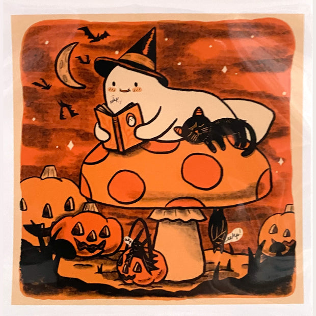 Illustration of a ghost laying on a mushroom, reading a book with a sleepy black cat nearby. Jack o lanterns are on the ground and piece is entirely orange, cream and black.