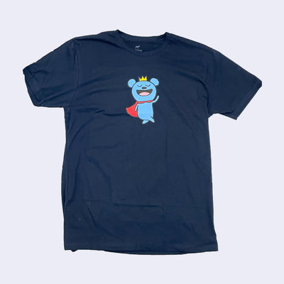 Navy blue shirt with a cartoon bear on it, wearing a red cape and a crown.