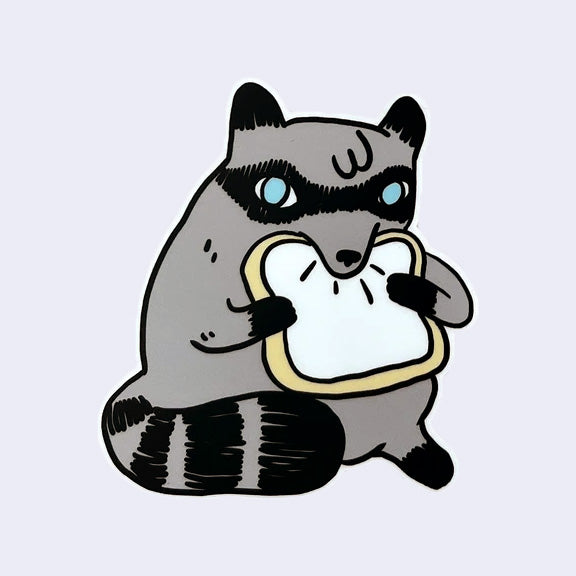 Die cut sticker of a chubby cartoon raccoon, munching on a piece of white bread.