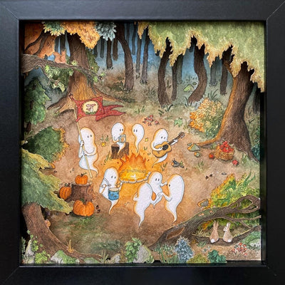 Shadow box diorama of an outdoor forest campfire scene, with ghosts sitting around and celebrating. Some play music, some dance, one holds and banner and the others converse. Piece is framed by cut paper forest scenery, with bunnies and a squirrel looking in.