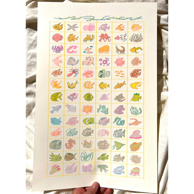 Risograph print of a large grid of many different small fish in a unique cartoon style.