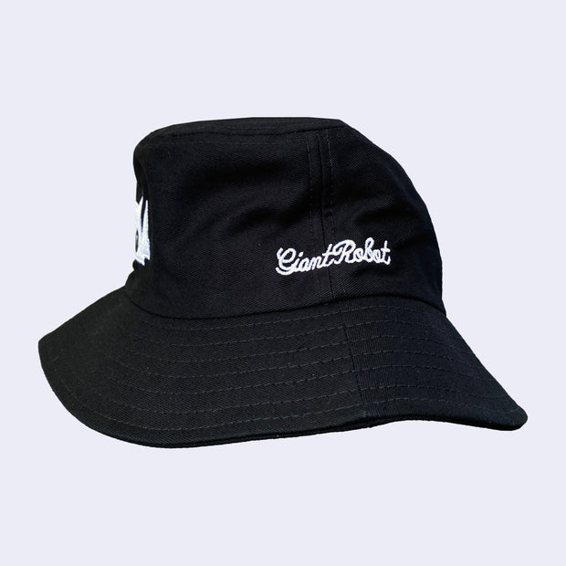 Black bucket hat with white embroidered cursive "giant robot" text.