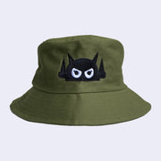 Olive green bucket hat with a black embroidered logo of a robot head, with white angry eyes.