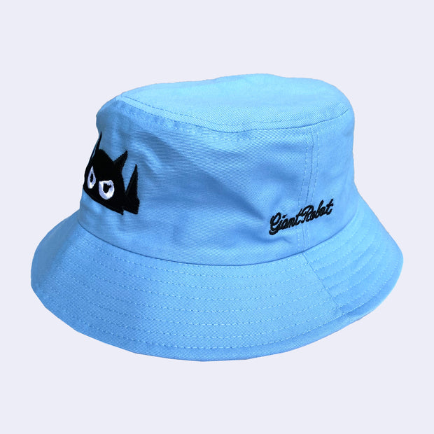 Baby blue bucket hat with black embroidered text that reads "giant robot" in cursive.