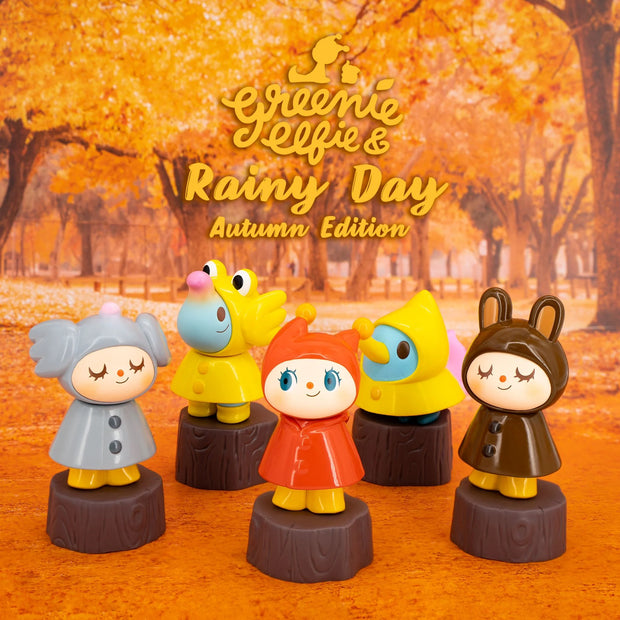 5 options for Greenie & Elfie Rainy Day Autumn blind box, with characters dressed in different colored rain slickers and standing on tree stumps.