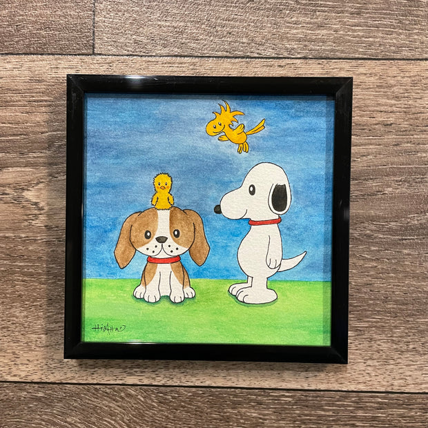 Watercolor painting of of a beagle sitting with a chick sitting atop its head. Standing next to them is Snoopy, who smiles and Woodstock flies behind him.