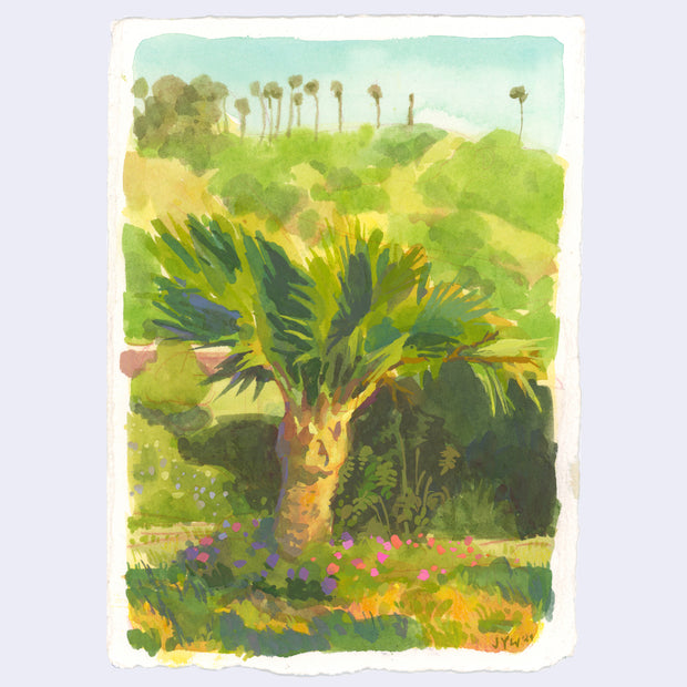 Plein air painting of a short palm tree, lined by a circle of flowers and lots of greenery around it. In the background is a hillside with palm trees atop it.