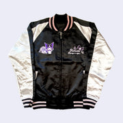 Front view of Shiny polyester bomber jacket with black body and white sleeves. Chest has 2 graphics, one on each side. Right is an embroidery of Kuromi leaning against a rose and the other is cursive text reading "Kuromi Always in Style!"