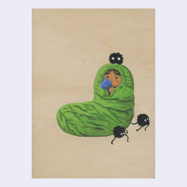 Painting on exposed wooden panel of a girl sitting in a green sleeping bag, covering all her body. Her head peeks out and drinks from a blue mug. Small black dust sprites are around.