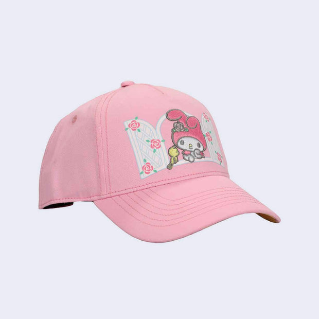 Pink cap with graphic of My Melody looking out a white window with a small yellow bird next to her.