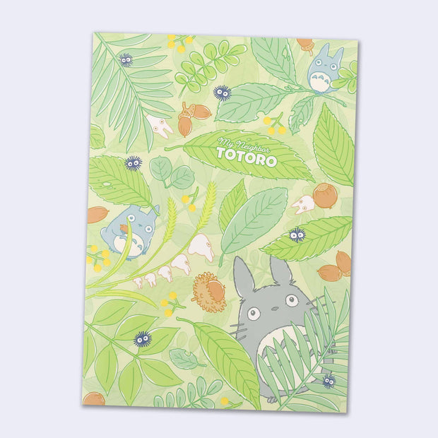 Green notebook cover with leaves, acorns and small Totoros.