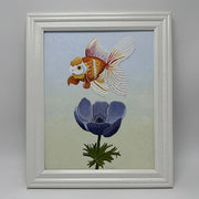 Painting of a cartoon style goldfish, floating above a purple flower. Background is a pastel blue to pastel green gradient. Piece is framed.