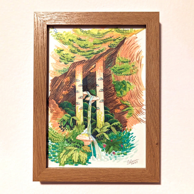 Marker drawing of a fantasy style cave setting, where 2 large windowed pillars emerge from it with a thin waterfall going between them. Lush plants frame the scene. Piece is in thick wood grain frame.