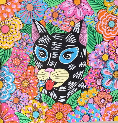 Colorful painting of a black wild cat with its tongue out, its positioned between many colorful flowers with various patterns: striped, polka dots, waves, etc.