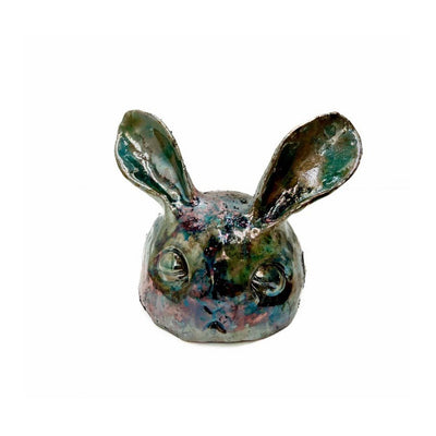 Dark multicolor ceramic bunny head.