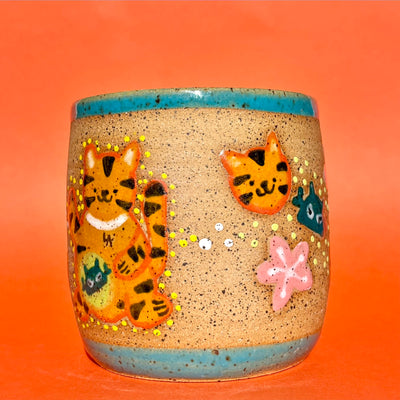 Earthenware ceramic pot with cartoon style illustrations of a tiger on the front, decorated with small robot heads and cherry blossoms.