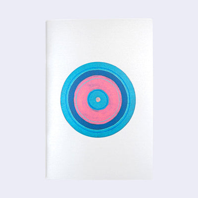 Zine cover of a blue and pink series of concentric circles atop each other.