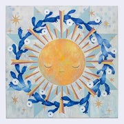 Painting of a yellow sun with graphic style rays coming off of it. A wreath of blooming cacti surround the sun. Background is painted white and blue like a quilt style pattern.