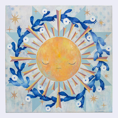 Painting of a yellow sun with graphic style rays coming off of it. A wreath of blooming cacti surround the sun. Background is painted white and blue like a quilt style pattern.