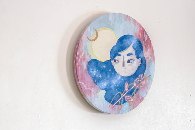 Painting on circle panel of a girl's head with long hair painted like the night sky. She looks off to the side and below her is a neon sign rose. Background is slightly abstract lines of strokes of blue and red with a moon behind her head.