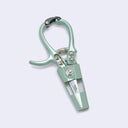 Mint green gardening shears on a light gray background