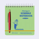 Green Scribble Notebook with a red pen on a light gray background