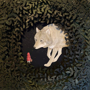 Layered cut paper diorama style sculpture, with many layers of leaves revealing a small scene of a red cloaked child facing a very large wolf, which looks at the child.