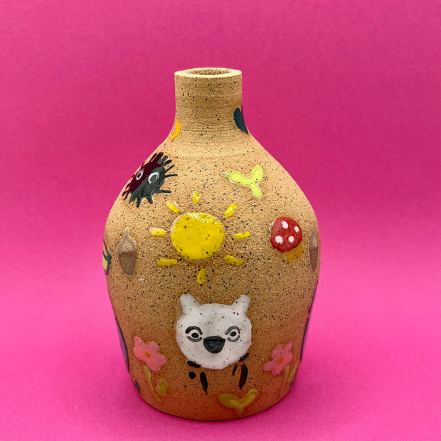 Stoneware vase, with small cute illustrations of My Neighbor Totoro themed doodles, such as dust sprites, chibi Totoros, leaves, acorns and mushrooms.