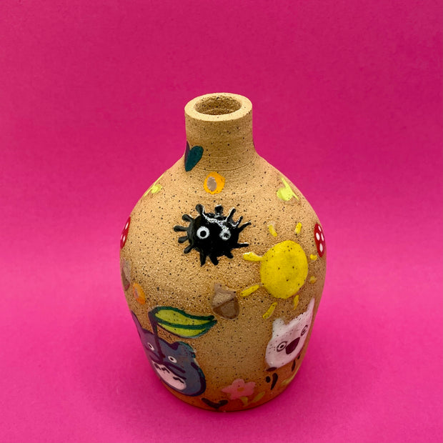 Stoneware vase, with small cute illustrations of My Neighbor Totoro themed doodles, such as dust sprites, chibi Totoros, leaves, acorns and mushrooms.
