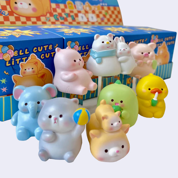 8 different animal themed figures, chubby with cute simple faces. Options are: elephant, hamster, cats, dinosaur, bird, pig and bunnies.