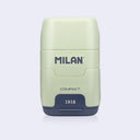 Light green and navy blue plastic case holding an eraser and a pencil sharpener within it, with 'Milan' branding on a light gray background