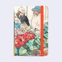 Notebook with illustration of two people at a market stand and colorful produce.