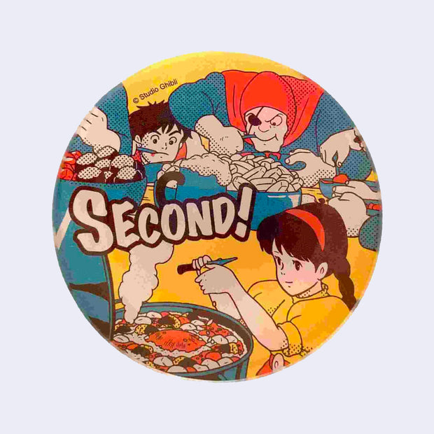 Round small glass dish with a colorful yellow, blue and red vintage style illustration from Castle in the Sky. Featuring an illustration of a girl preparing dinner, with people voraciously eating in the background.