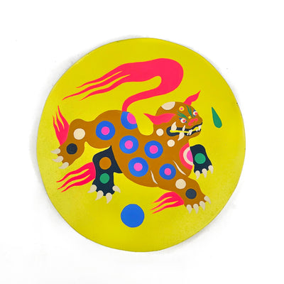 Illustration of a dark yellow Asian folklore style dog, with a long lion like body and fanged mouth. It has bright red hair coming off its body. Illustration is on neon yellow circular panel.