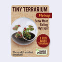 Product packaging for a tiny glass terrarium with a Venus Flytrap plant growing inside.