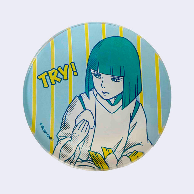 Blue and yellow vertically striped glass plate featuring imagery from Spirited Away. Haku holds an onigiri and looks off to the side, accompanying by stylized text that reads "TRY!"