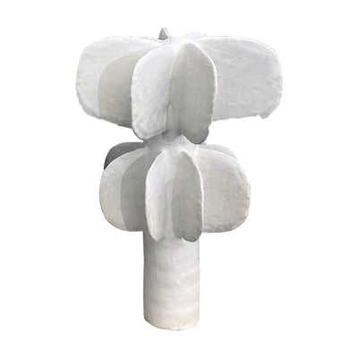 Ceramic tree made up of layered semi circles, all white with a thick trunk.