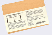 Back cover of kraft color notebook with rounded corners and metal spiral binding on side, with paper insert showing various specs written in English and Japanese.