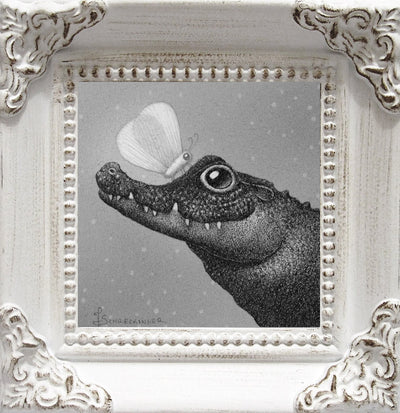A finely detailed illustration of a semi-cartoonish crocodile, smiling kindly up at a large moth on its snout. Illustration is greyscale and maintains a slightly fuzzy visual feature and is in an ornate white wooden frame.