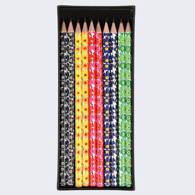 Rectangular case of pencils, open to reveal 5 designs with 2 of each, all with floral patterns. Main colors are black, yellow, red, blue and green.