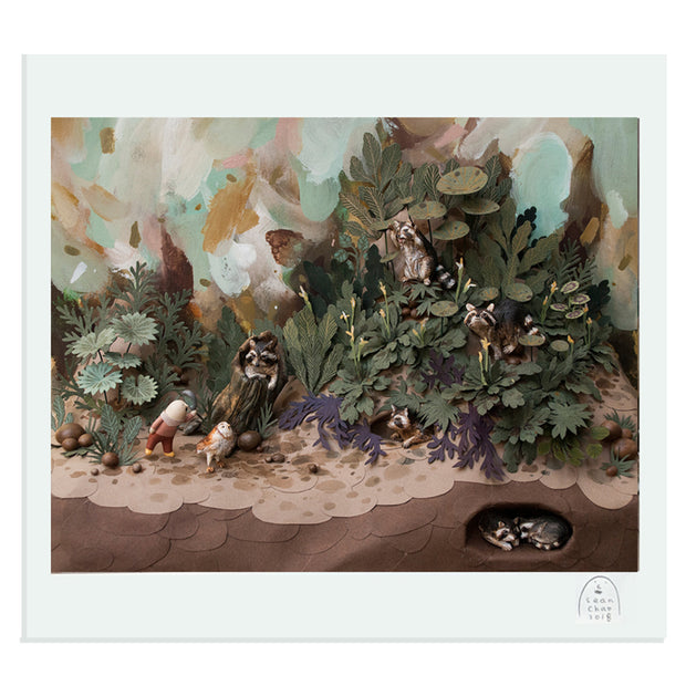 Photograph of a detailed clay and paper diorama. A person walks with an owl through a lush forest setting, waving to the various raccoons standing within the scene. 2 raccoons can be seen buried under the ground. 