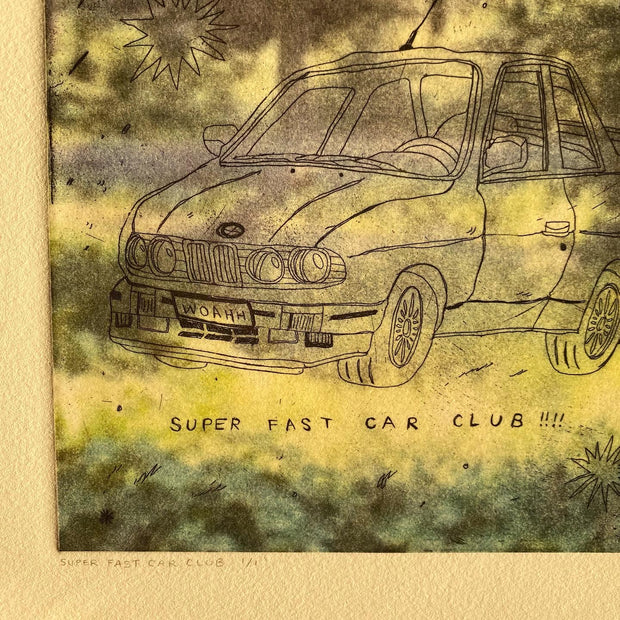  Close up of an intaglio print of a line art car that says "WOAHH" on the license plate and "Super Fast Car Club!!!" written below. The background is a photograph of a forest setting.