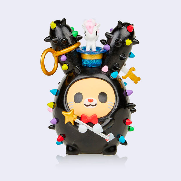 Vinyl bunny figure with a round, glittery black body with colorful spikes like a cacti. It holds a star headed wand and has an upside down hat on its head, which a tiny unicorn pops out of.