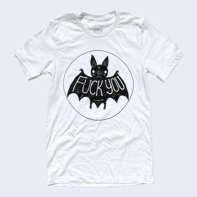 Front view of white t-shirt. On the center chest area is a drawing of a cute black bat. Large text on its wings says fuck you.